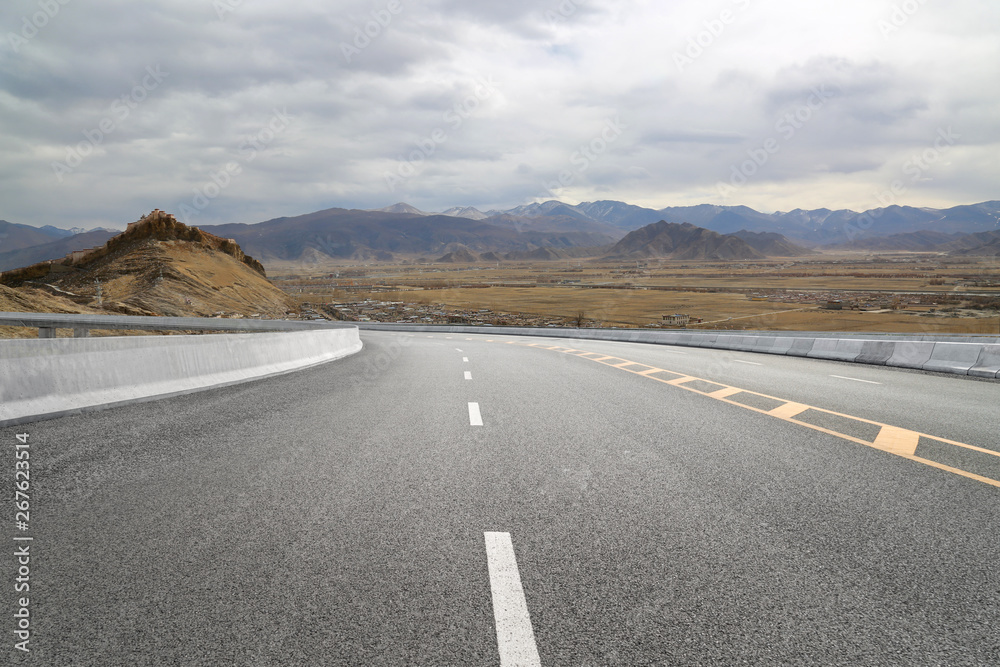 Empty highways and distant mountains