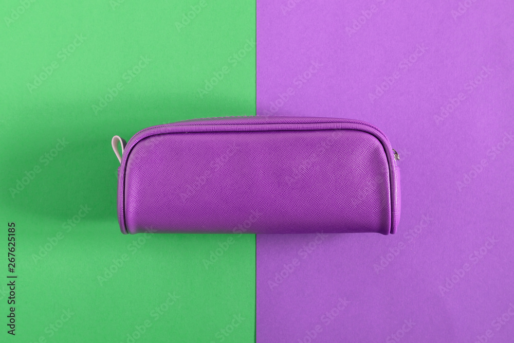 Obraz premium Back to school. Colorful minimal composition of school supplies on green and purple background. Flat lay, top view, copy space