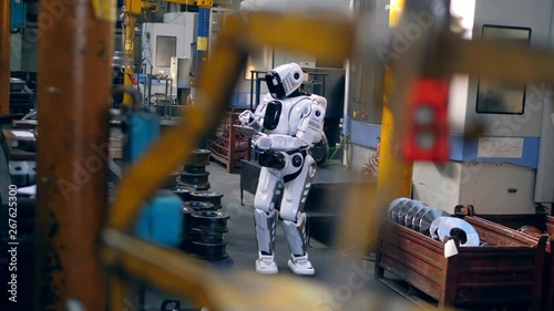 Wallpaper Mural Factory premises with a droid operating a tablet Torontodigital.ca