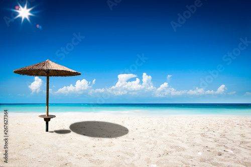 Beach background of free space and umbrella 