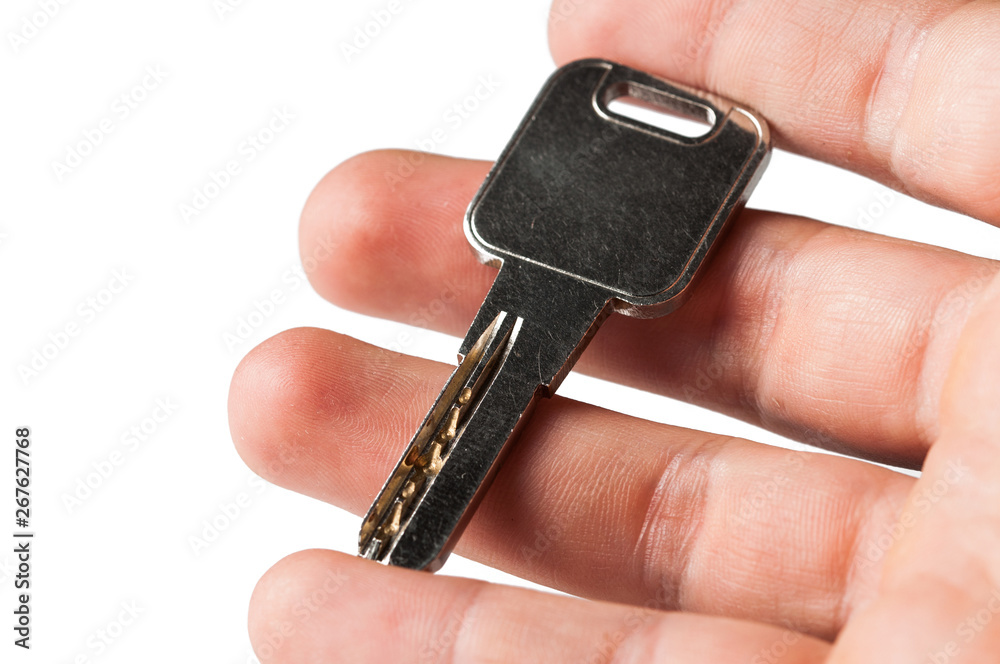 Metal silver key in hand isolated on white background Metal silver key in hand isolated on white background