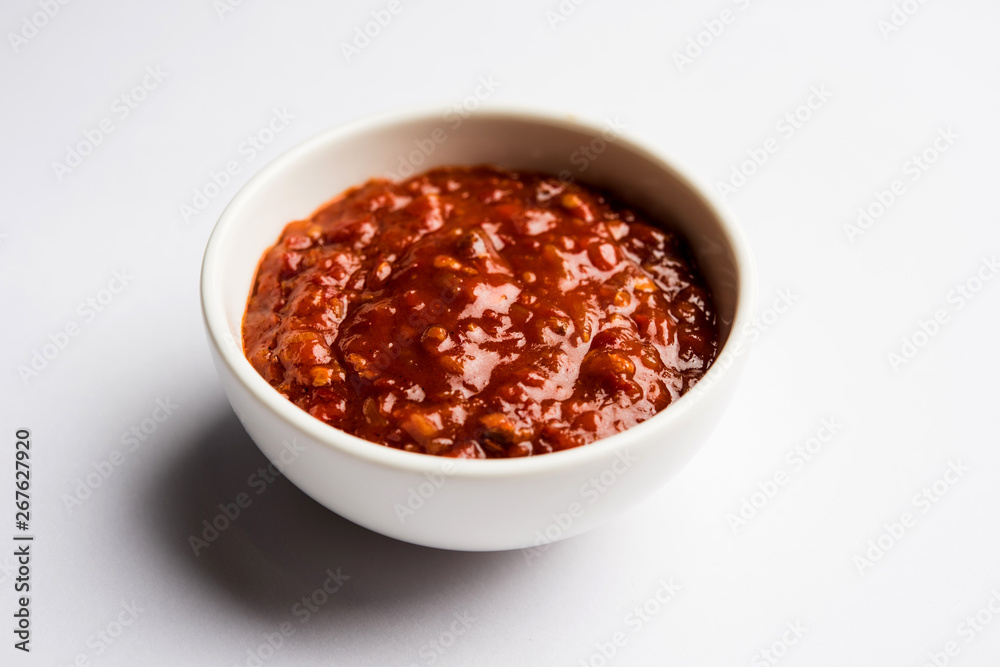 Schezwan Sauce / Szechuan chutney is an important ingredient in Chinese recipe. served in a bowl, isolated. selective focus Schezwan Sauce / Szechuan chutney is an important ingredient in Chinese recipe. served in a bowl, isolated. selective focus