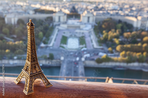 Montmartre. Eiffel tover souvenit toy on background of sunrise view of the city from the survey platform of Eiffel tower photo