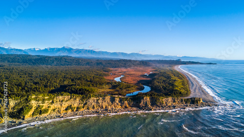 River running to the Tasman sea through the native forest. West Coast, South Island, New Zealand
