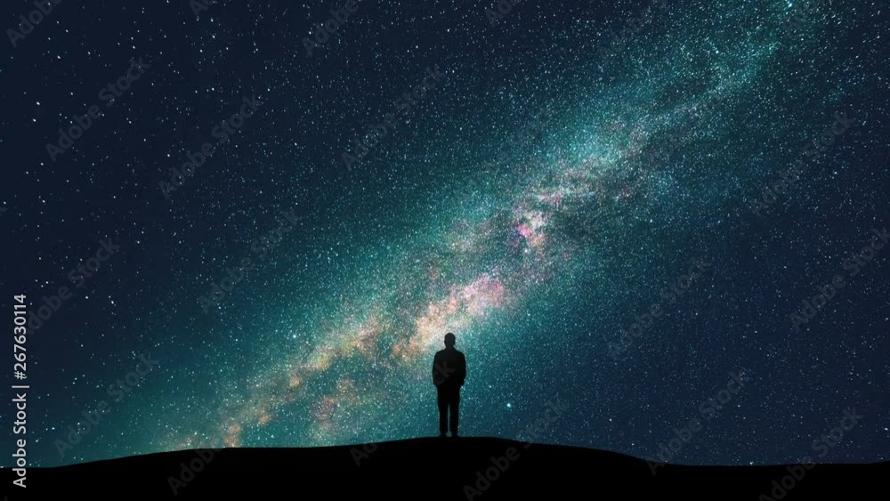 The male standing against the starry sky. time lapse