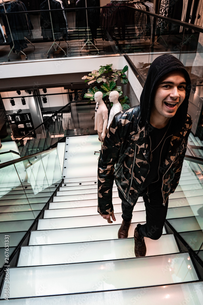 Obraz premium Happy guy walking up stairs