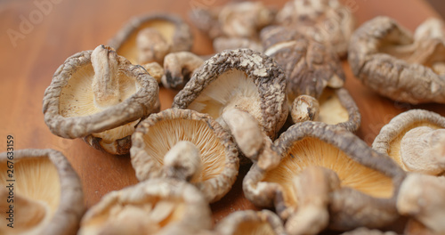 Stack of dry mushroom on wooden plate