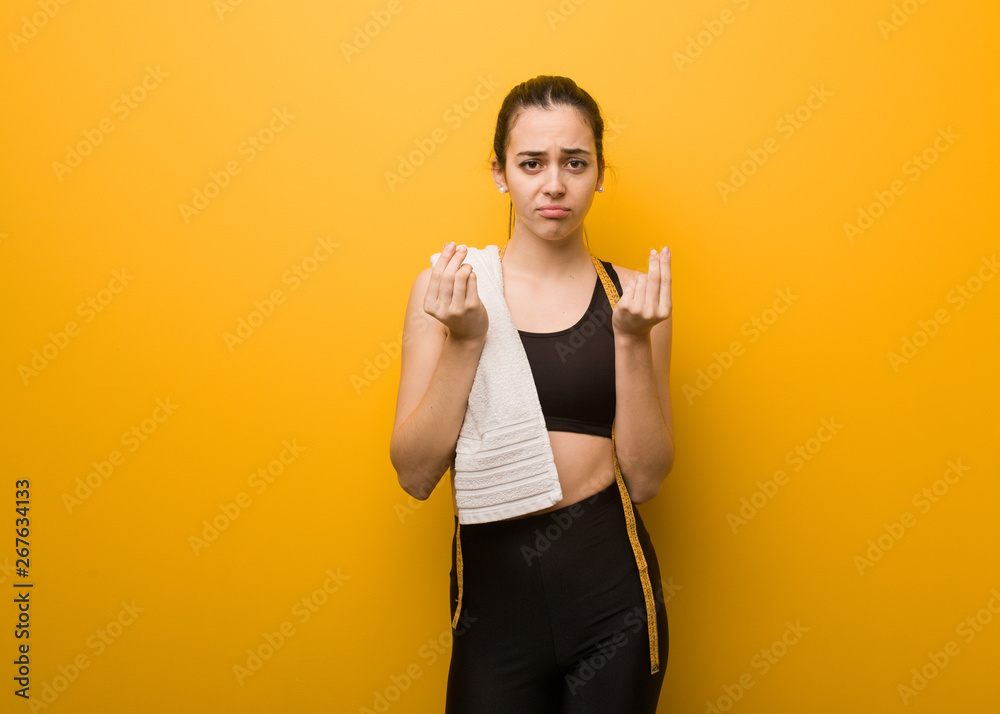 Young fitness girl doing a gesture of need Young fitness girl doing a gesture of need