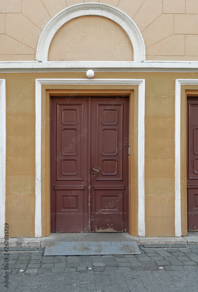Fototapeta premium Old wooden door entrance in public building