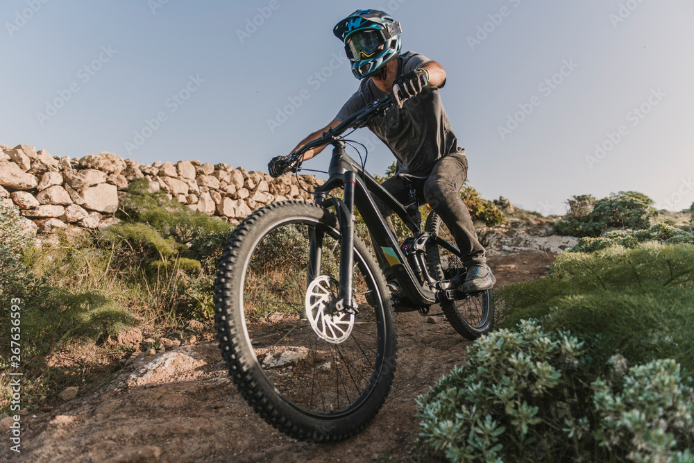 Spain, Lanzarote, mountain biker on a trip in desertic landscape Spain, Lanzarote, mountain biker on a trip in desertic landscape