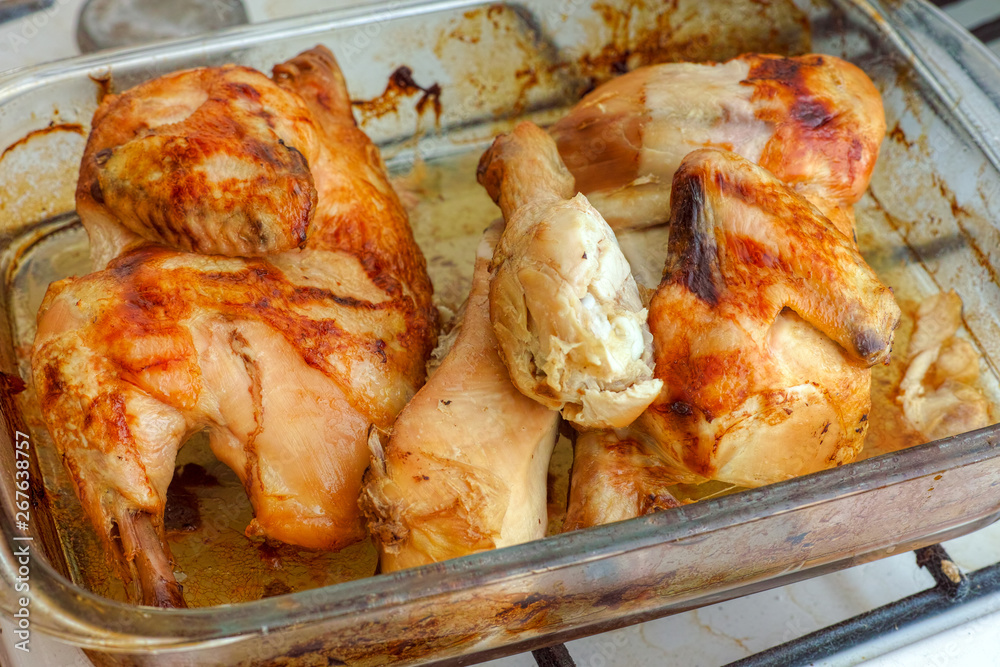 Roasted chicken in a glass tray