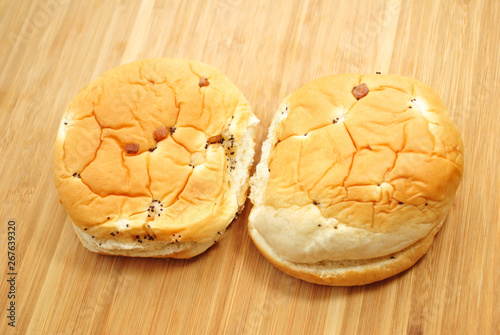 Two Onion Rolls on a Wooden Surface photo