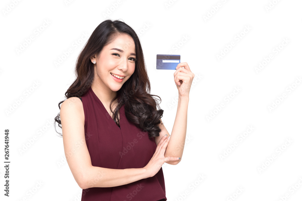 Young smiling beautiful Asian woman presenting credit card in hand for making payment shopping isolated on white background Young smiling beautiful Asian woman presenting credit card in hand for making payment shopping isolated on white background