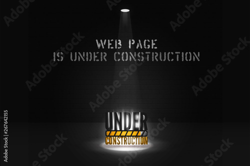 Web site banner is coming soon with floodlight on dark scene. Under construction text in spotlights