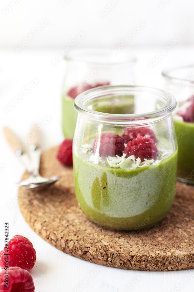 White chocolate cream mousse with matcha, avocado, pistachio, fresh raspberries - healthy vegan dairy free, gluten free White chocolate cream mousse with matcha, avocado, pistachio, fresh raspberries - healthy vegan dairy free, gluten free