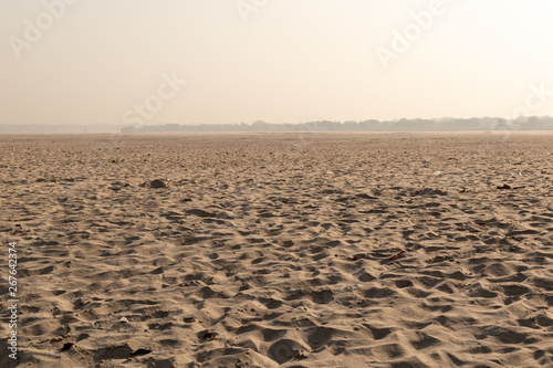 The other side of the Ganges with sand dunes, Land of the dead, Varanasi, India