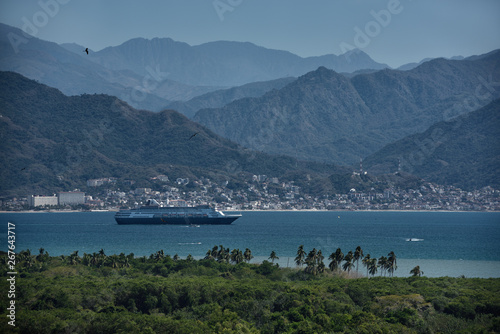 Photography Cruise ship leaving Banderas Bay Puerto Vallarta Mexico with Sierra Madre mounta