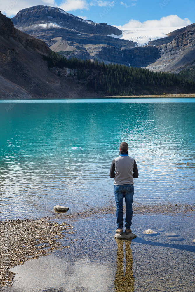 Canada, Jasper and Banff National Park, Icefields Parkway, man at lakeside Canada, Jasper and Banff National Park, Icefields Parkway, man at lakeside