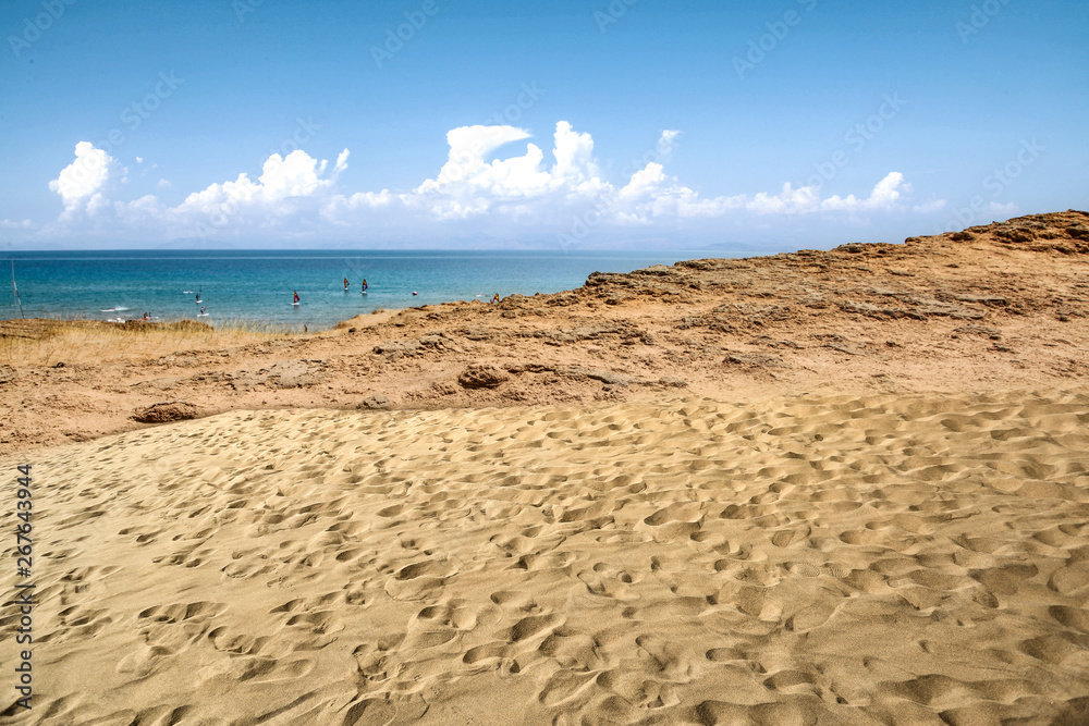 Beach background of free space and summer day. Hot yellow sand and blue sky. Beach background of free space and summer day. Hot yellow sand and blue sky.