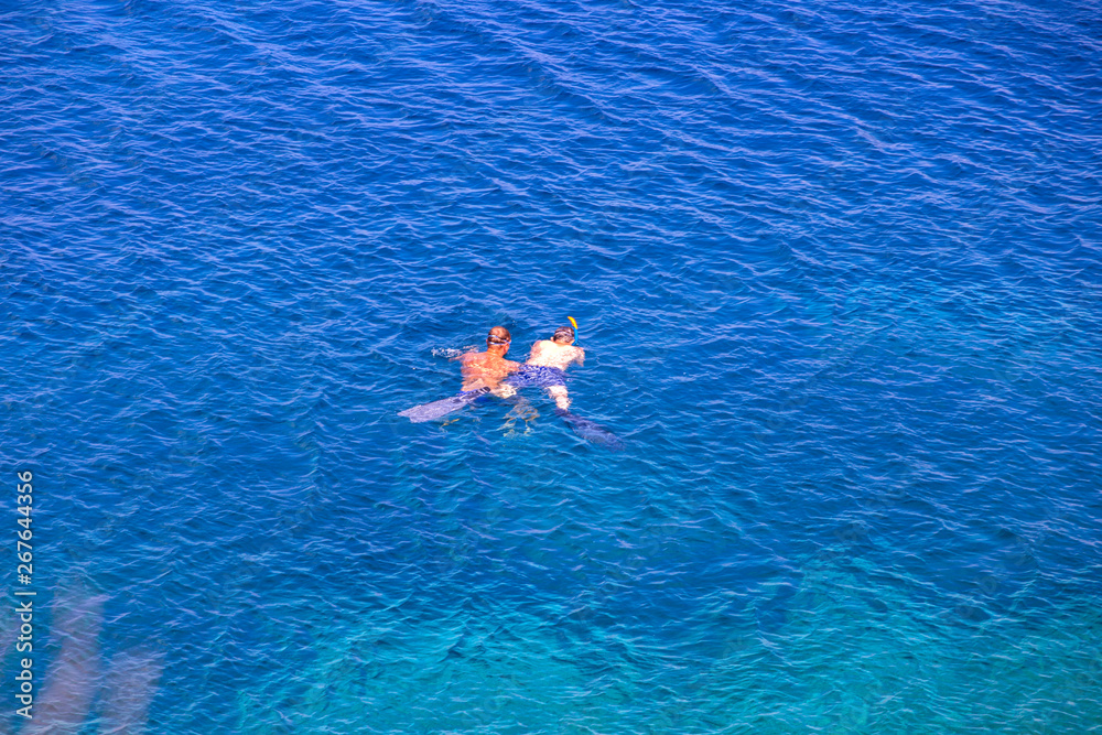 Two guys snorkeling close to Vis island, Croatia