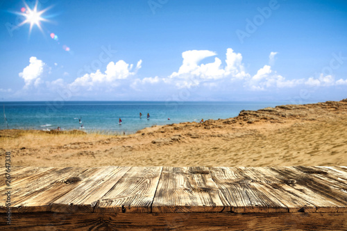 Summer day and wooden table background of free space. 