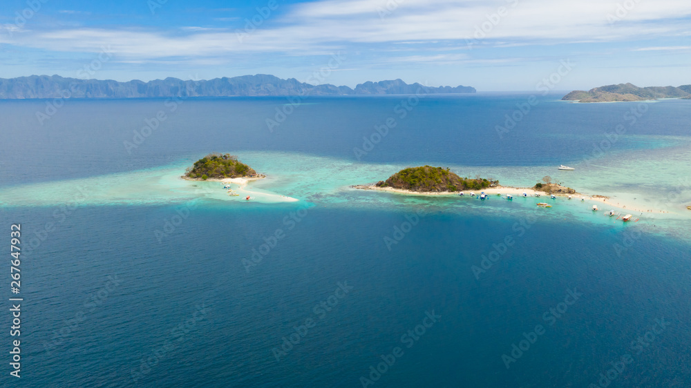 Tropical island Bulog Dos. Tourists walking along the sand bar Seascape in the tropics aerial view.Philippines, Palawan