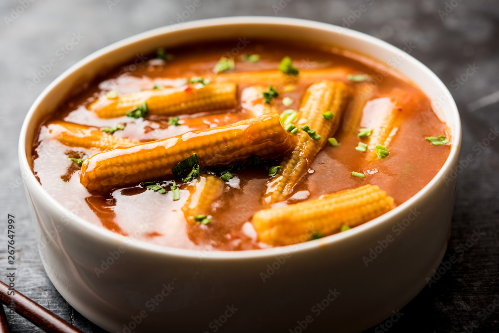 Baby Corn Manchurian with gravy - popular Indo-chinese recipe. selective focus Baby Corn Manchurian with gravy - popular Indo-chinese recipe. selective focus