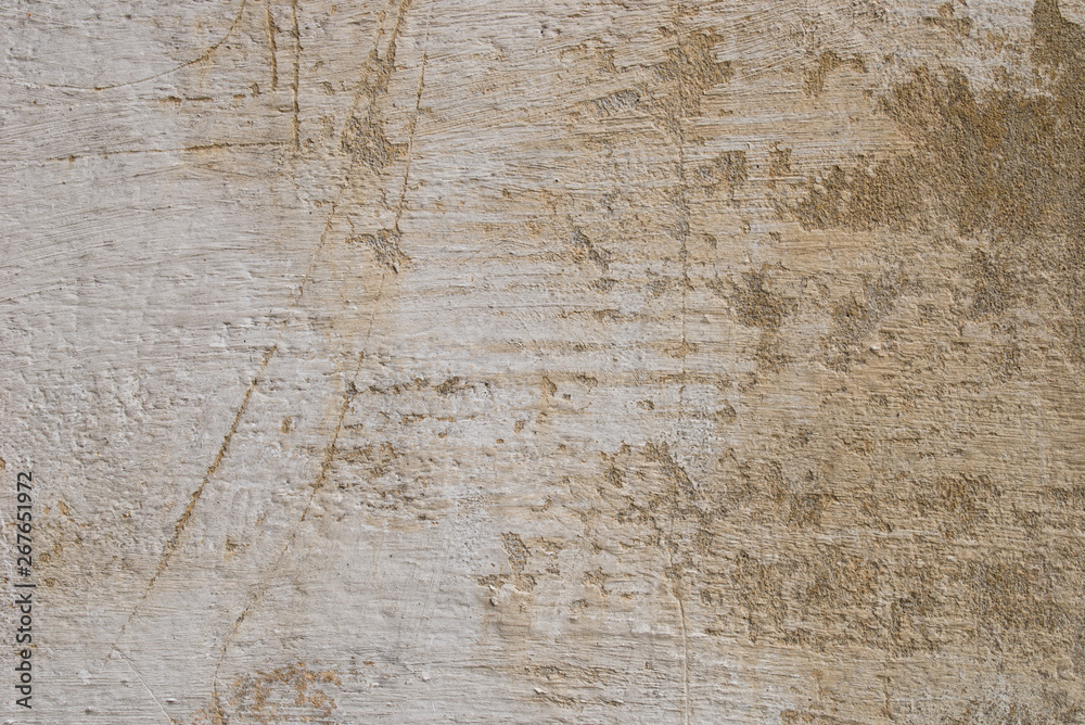 Fototapeta premium old obsolete beige plastered wall background texture