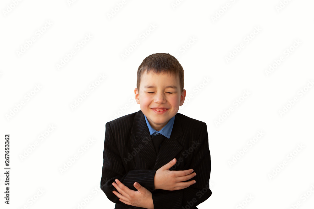 boy laughs, clasping himself with hands, isolate