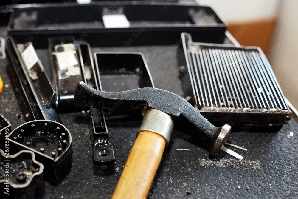 Naklejka premium Various leather processing tools and utensils used to produce leather items, handbags, shoes
