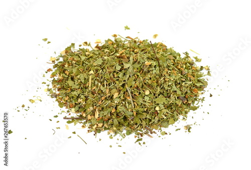 Pile of dried oregano isolated on white. Pile of dried oregano leaves on a white background. Spice for pizza. Pizza ingredient.