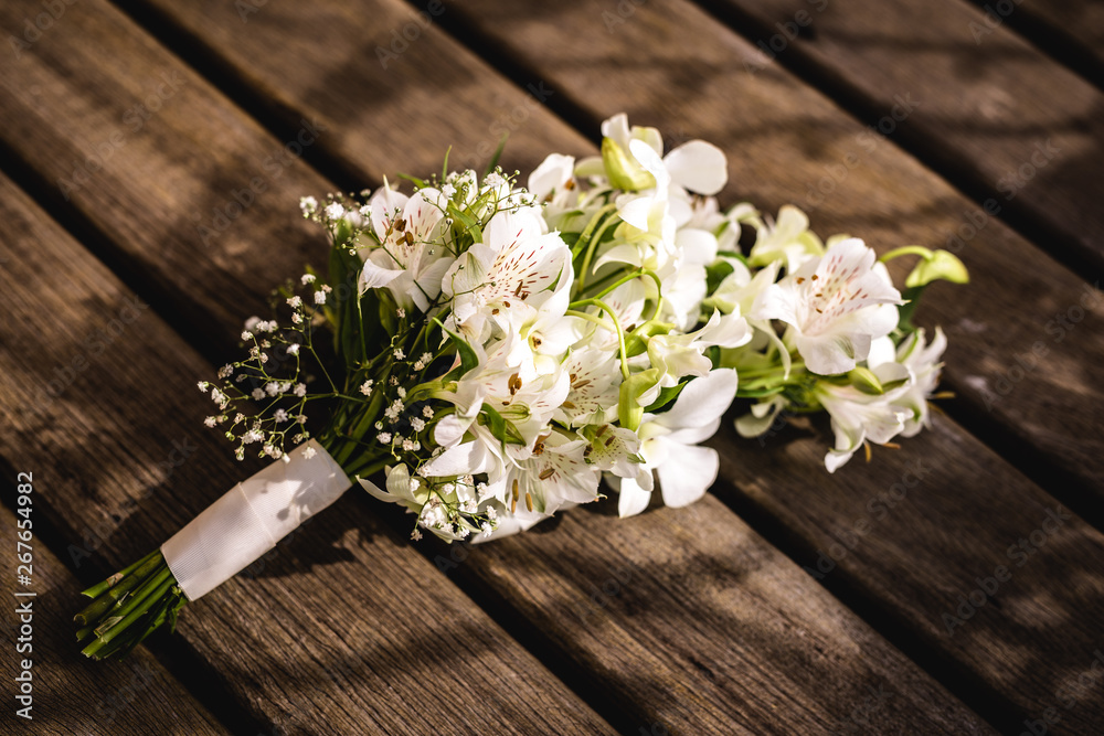 wedding bouquet on wooden table, rustic bouquet for bride. wedding bouquet on wooden table, rustic bouquet for bride.