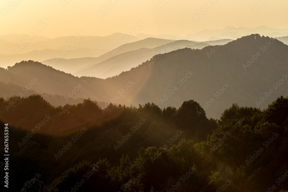 Sunset in the mountains overlooking the series of hills. Sunny Bunny