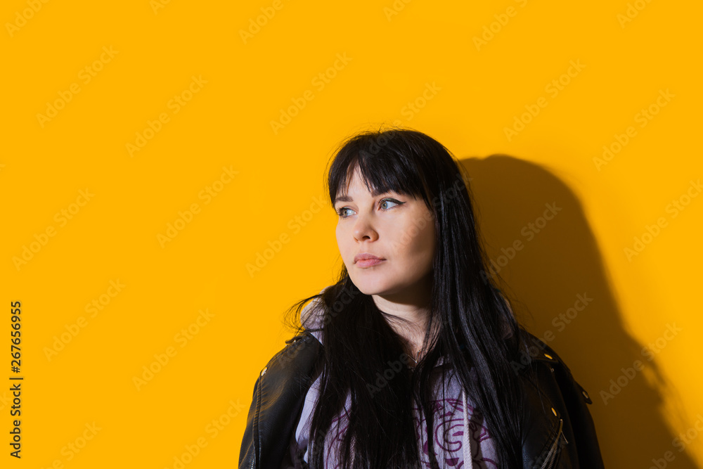 Portrait upset girl woman hood sunglasses background yellow sad grief sorrow brunette shadow sun light tropical leaves Portrait upset girl woman hood sunglasses background yellow sad grief sorrow brunette shadow sun light tropical leaves