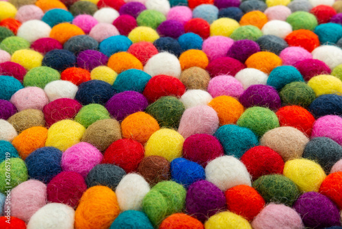 Multicolored felt ball rug detail, colorful texture