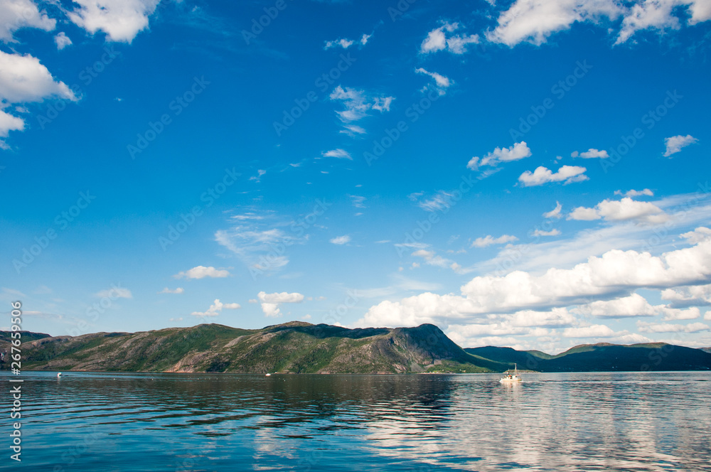 trip to nordkapp, view to a fjord with a boat