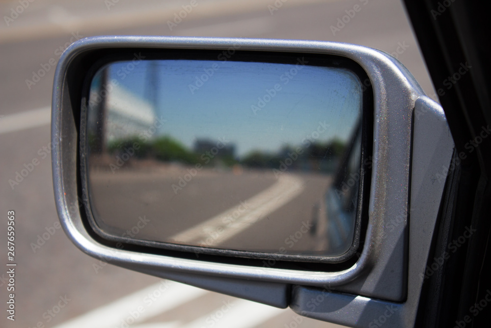 The road in the side view mirror