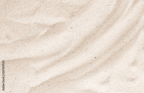 Sand on the beach as background. Sand Texture. Brown sand. Background from fine sand.