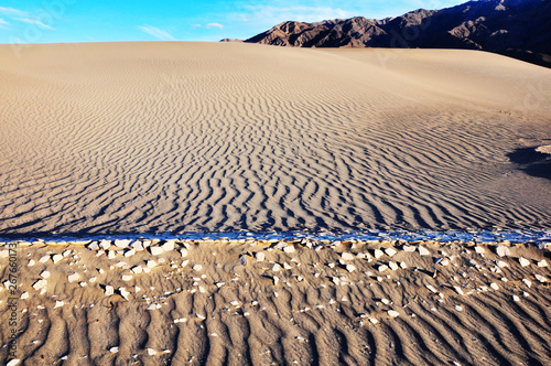 High conrast shadows on sand ripples in dunes at sunset,  Death Valley National Park photo