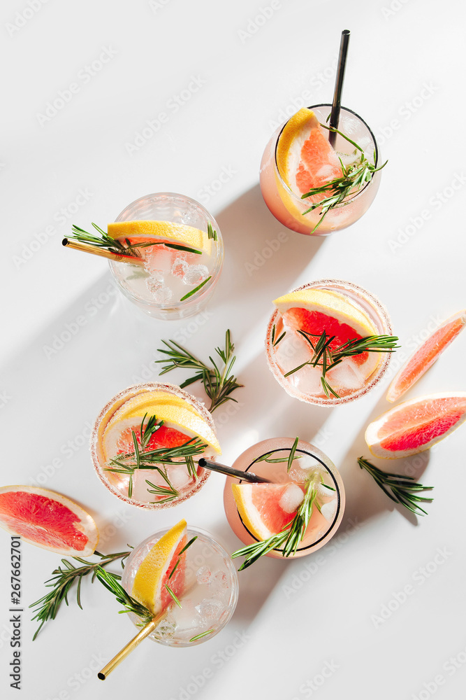 Naklejka premium Grapefruit and Rosemary cocktail. Refreshing and non-alcoholic drink perfect for spring or summer.