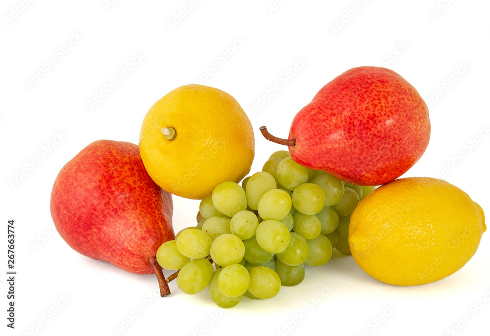 Ripe yellow lemon with a bunch of green grapes and delicious red pears Ripe yellow lemon with a bunch of green grapes and delicious red pears