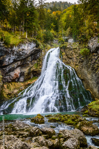 Gollinger Waterfall in Golling an der Salzach near Salzburg, Austria. Stunning view of cascade waterfall over mossy rocks in the Alps with long exposure