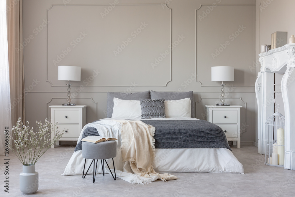 New york style bedroom interior with symmetric design, copy space on empty grey wall - obrazy, fototapety, plakaty 
