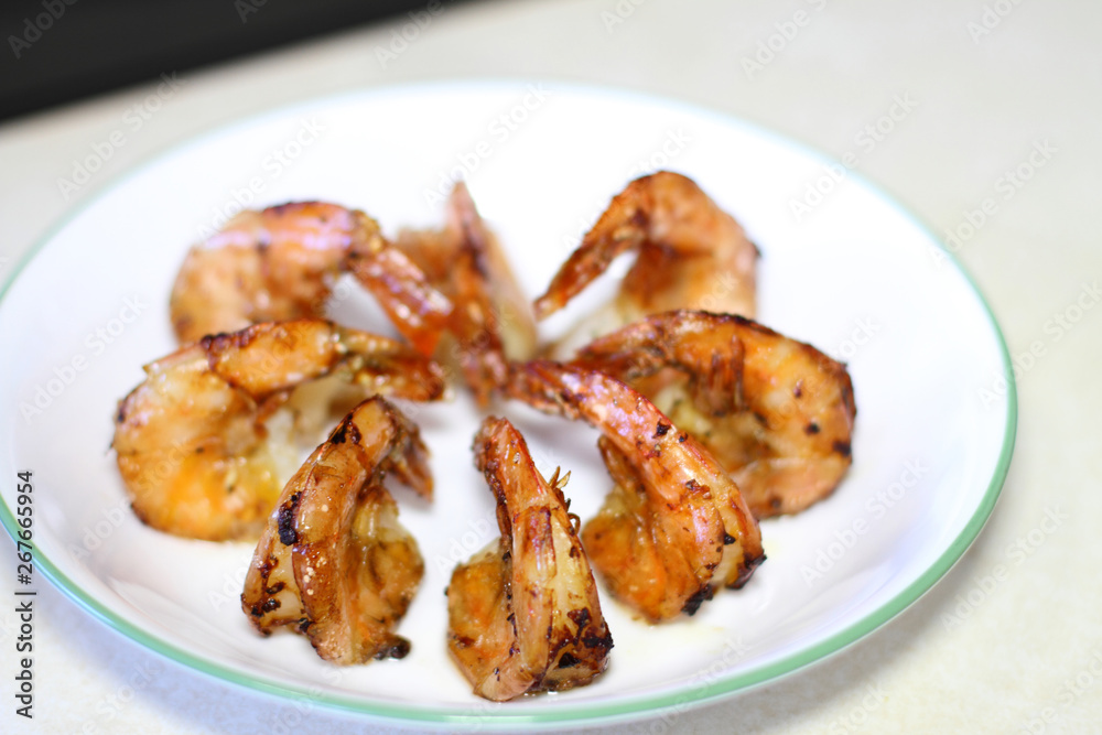 Delicious plate of shrimp cooked in butter and garlic. Delicious plate of shrimp cooked in butter and garlic.