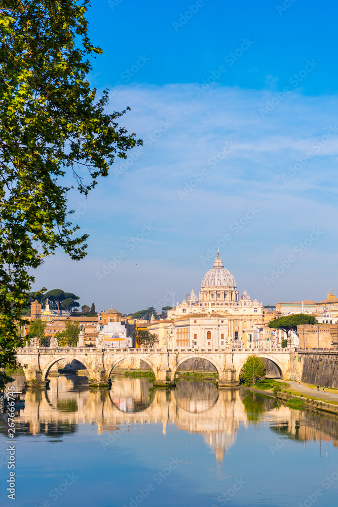 Saint Peter Basilica (San Pietro) in Vatican city with Saint Angelo Bridge over Tiber river