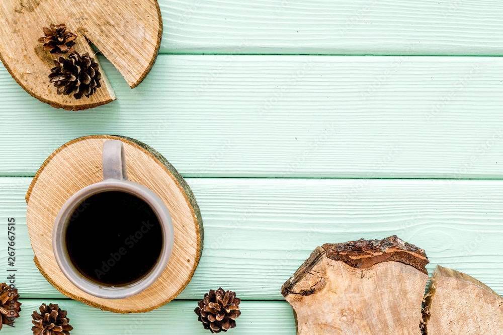 Tree stumps, coffee and cones for presentation background top view copy space