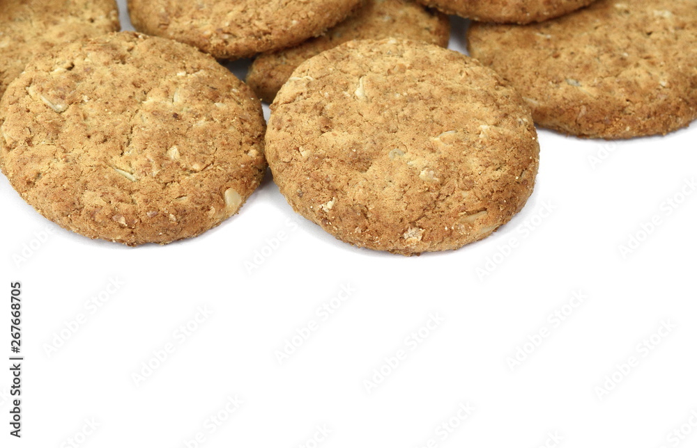 Round whole wheat biscuit, cookie with raisins isolated on white background. Biscuits with whole-wheat (wholemeal) flour isolated on white background Round whole wheat biscuit, cookie with raisins isolated on white background. Biscuits with whole-wheat (wholemeal) flour isolated on white background