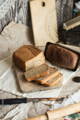 fresh homemade sourdough wheat form bread  served on the rustic background