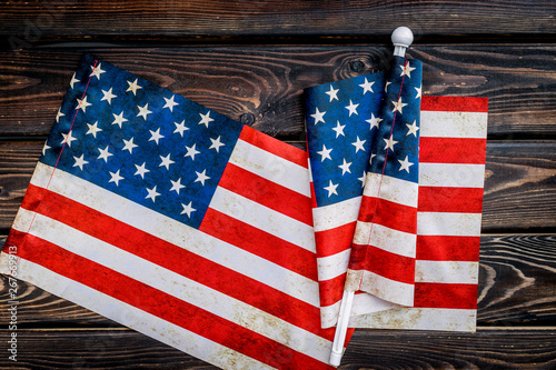 Memoral day of United States of America with flag on wooden background top view photo