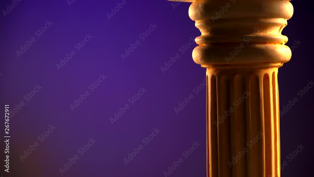 Single ancient greek column rotating slowly on color background, copy space text area Single ancient greek column rotating slowly on color background, copy space text area